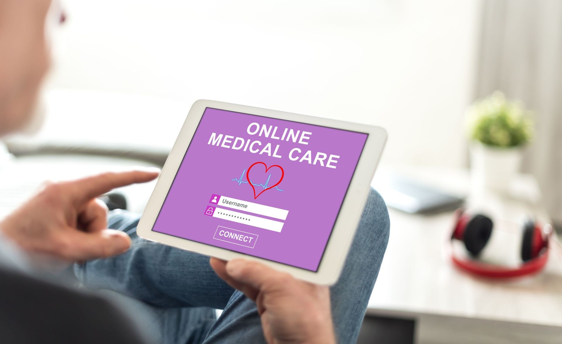 Tablet screen displaying an online medical care concept Tablet screen displaying an online medical care concept